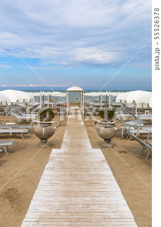 Empty beach with white sunshades, Italy, Riccione Empty beach with white sunshades, Italy, Riccione 55526378