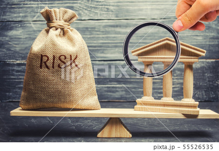 A money bag with the word Risk and a bank building A money bag with the word Risk and a bank building 55526535