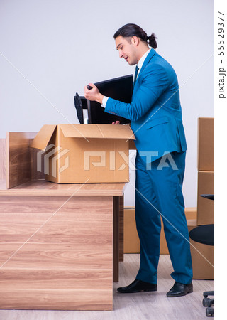 Young handsome businessman being fired from his work Young handsome businessman being fired from his work 55529377