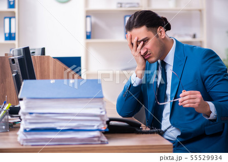 Young handsome businessman sitting in the office 55529934