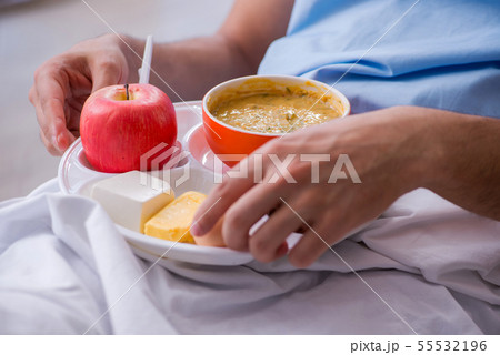 Male patient eating food in the hospital Male patient eating food in the hospital 55532196