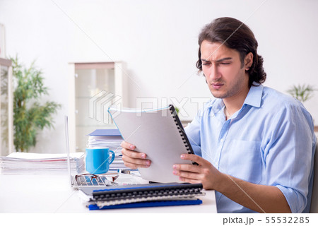Young male employee working at home 55532285