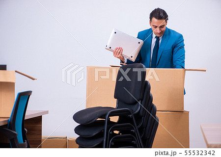 Young handsome businessman being fired from his work Young handsome businessman being fired from his work 55532342