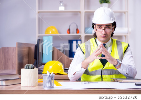 Young male architect working in the office Young male architect working in the office 55532720