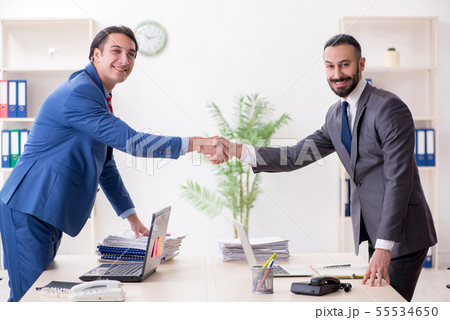 Two male colleagues in the office 55534650