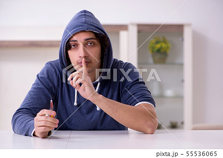 Young man having problems with narcotics at home 55536065