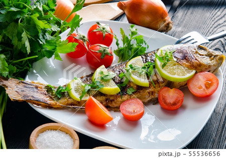 Fried fish served on the plate Fried fish served on the plate 55536656
