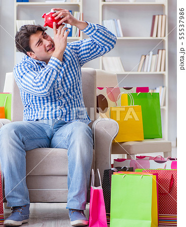 Young man after excessive shopping at home 55537986