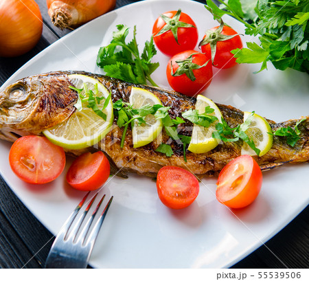 Fried fish served on the plate Fried fish served on the plate 55539506