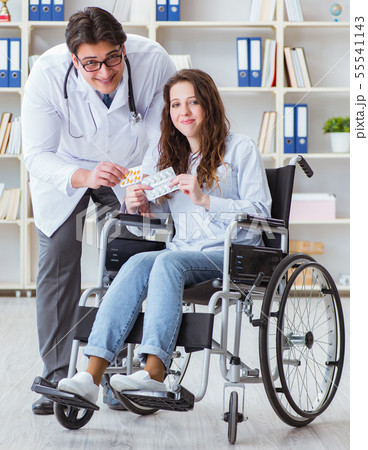 Disabled patient on wheelchair visiting doctor for regular check Disabled patient on wheelchair visiting doctor for regular check 55541143