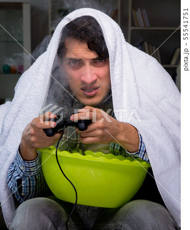 Sick man doing inhalation at night in home 55541751