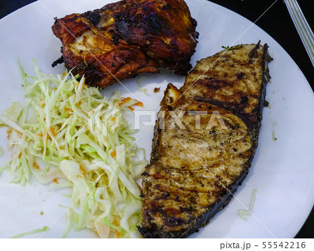 Grilled fish on white dish for lunch Grilled fish on white dish for lunch 55542216