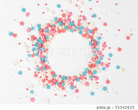 Sprinkles in round shape on white, copy space 55542625