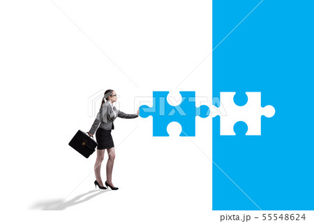Concept of businesswoman with missing jigsaw puzzle piece 55548624