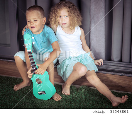 Portrait of a cute kids with ukulele 55548861