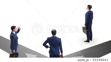 Young businessman at crossroads in uncertainty concept 55549041