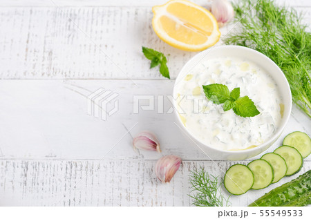 Greek dip sauce or dressing tzatziki. 55549533