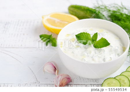 Greek dip sauce or dressing tzatziki. 55549534