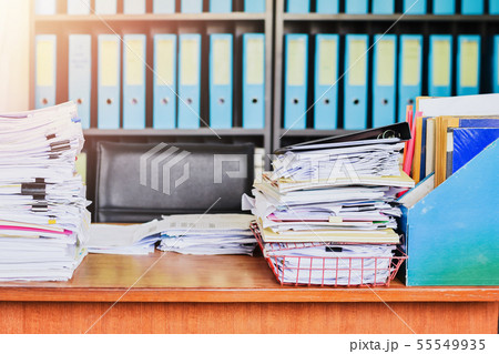 Heap of paperwork stack documents on office desk ,business documents billing and examination to Heap of paperwork stack documents on office desk ,business documents billing and examination to 55549935