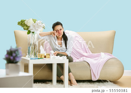 Young woman suffering from hausehold dust or seasonal allergy. Young woman suffering from hausehold dust or seasonal allergy. 55550381