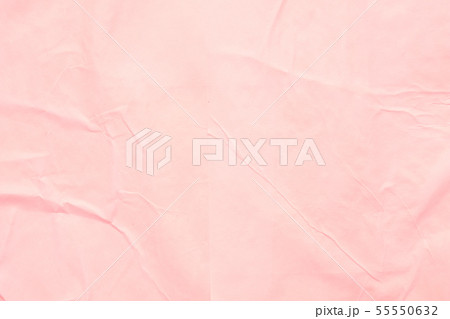 coral pink wet paper wrinkled texture background 55550632