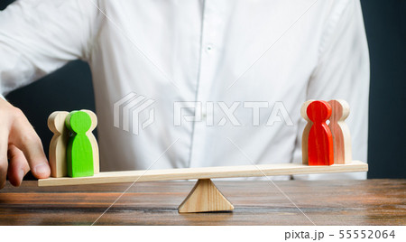 A man changes the balance of scales in favor of  55552064