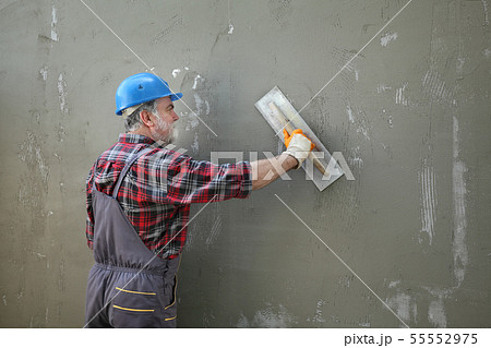 Wall insulation, spreading mortar over mesh and Wall insulation, spreading mortar over mesh and 55552975