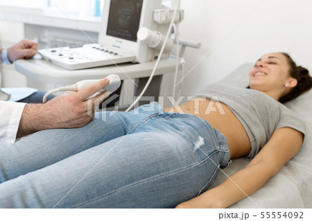 Young woman having 4D ultrasound scan. Ultrasound Young woman having 4D ultrasound scan. Ultrasound 55554092