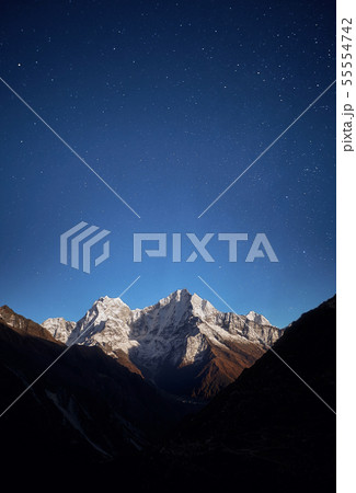 Thamserku mountain night view in the light of the rising Moon. Thamserku mountain night view in the light of the rising Moon. 55554742