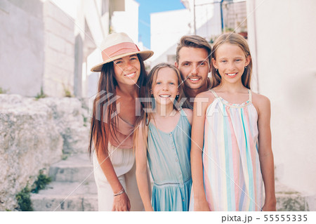 Family of parents and kids vacation in European vacation 55555335