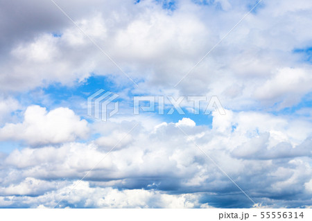 low dense cumulus clouds in blue sky on summer day low dense cumulus clouds in blue sky on summer day 55556314