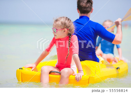 Little girls and young dad kayaking during summer vacation Little girls and young dad kayaking during summer vacation 55556814
