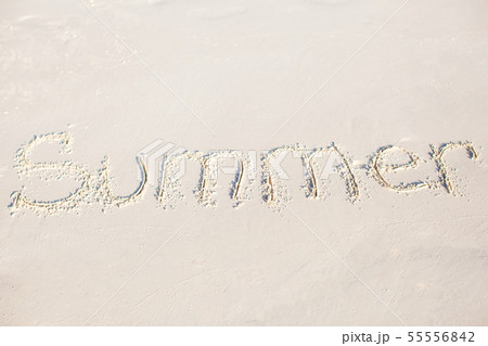 Word Summer handwritten on sandy beach with soft ocean wave on background Word Summer handwritten on sandy beach with soft ocean wave on background 55556842