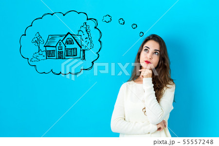Dreaming of new home with young woman Dreaming of new home with young woman 55557248