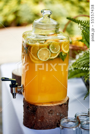 Refreshing lemonade in a steamed-up can. Picnic, catering at the event. Refreshing lemonade in a steamed-up can. Picnic, catering at the event. 55557438