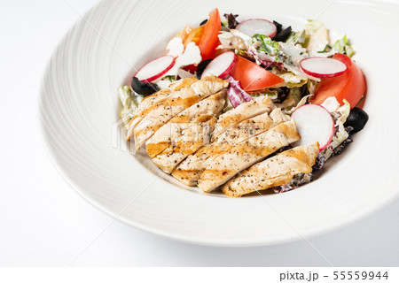 grilled chicken with vegetables on the white plate grilled chicken with vegetables on the white plate 55559944