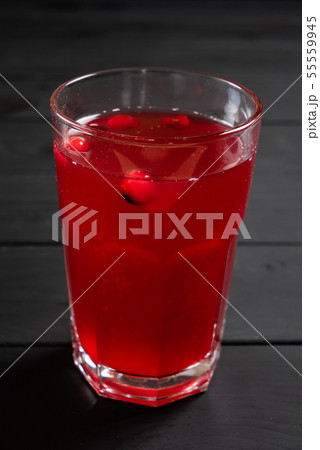 cranberry lemonade on the black wooden background cranberry lemonade on the black wooden background 55559945