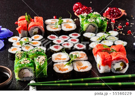 Rainbow Sushi Roll with salmon, eel, tuna, avocado, royal prawn, cream cheese Philadelphia 55560229