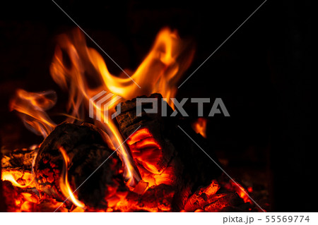 Fire is red in a closed oven on black background. 55569774