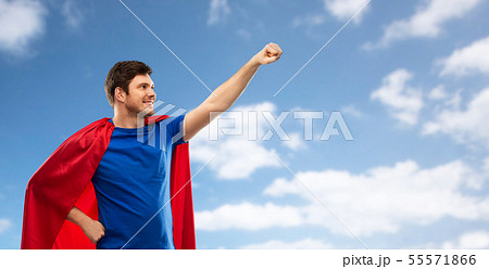 man in red superhero cape over sky background man in red superhero cape over sky background 55571866