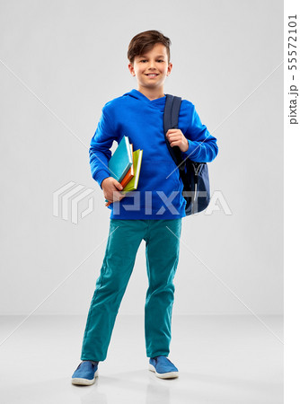 smiling student boy with books and school bag 55572101
