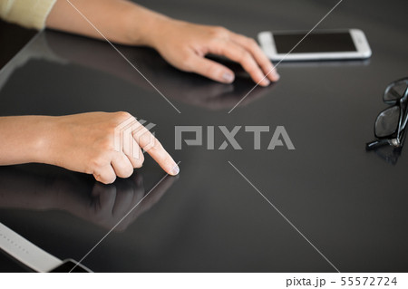 close up of woman using black interactive panel 55572724