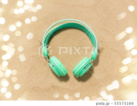 earphones on summer beach sand earphones on summer beach sand 55573169