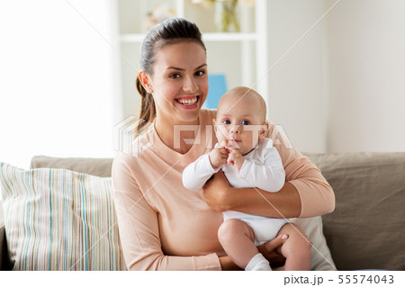 happy mother with little baby boy at home 55574043