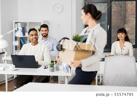 new female office worker with personal stuff new female office worker with personal stuff 55574795