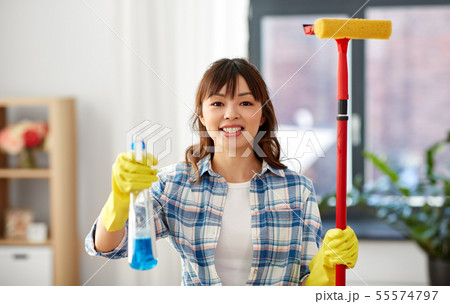 asian woman with window detergent and sponge mop asian woman with window detergent and sponge mop 55574797