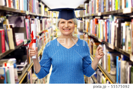 happy senior graduate student woman with diploma 55575092