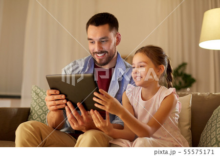 father and daughter with tablet computer at home 55575171