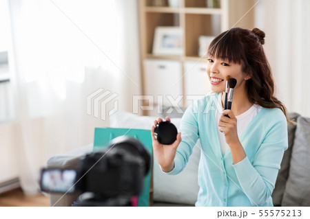 female beauty blogger making video about make up 55575213