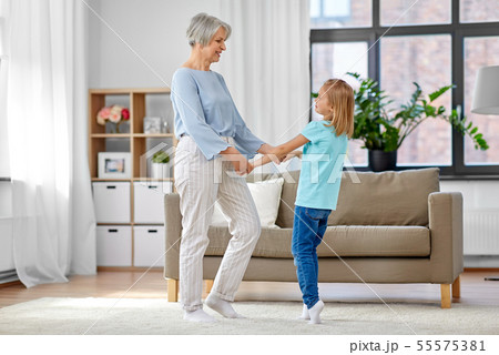 grandmother and granddaughter having fun at home grandmother and granddaughter having fun at home 55575381